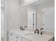 Modern bathroom features double sinks, large mirror, and sleek fixtures at 1819 Laurel Ridge Sw Dr, Conyers, GA 30094