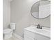 Well-maintained bathroom features a new toilet, vanity, sink, and mirror at 1819 Laurel Ridge Sw Dr, Conyers, GA 30094