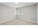 This bedroom includes a carpet floor and a window that provides natural light at 1819 Laurel Ridge Sw Dr, Conyers, GA 30094