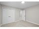 Neutral bedroom has a carpet floor, closet, and plenty of natural light at 1819 Laurel Ridge Sw Dr, Conyers, GA 30094