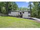 Charming exterior with a well-manicured lawn, stylish siding, and welcoming front entry at 1819 Laurel Ridge Sw Dr, Conyers, GA 30094