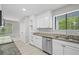 Updated kitchen features stainless steel appliances, granite countertops, and recessed lighting at 1819 Laurel Ridge Sw Dr, Conyers, GA 30094