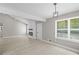 Spacious living room with modern lighting, fresh paint, and open layout at 1819 Laurel Ridge Sw Dr, Conyers, GA 30094