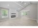 Bright living room with a modern fireplace, high ceilings, recessed lights, and new floors at 1819 Laurel Ridge Sw Dr, Conyers, GA 30094