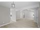 Bright living room flows into dining area with hardwood floors and modern accents at 1819 Laurel Ridge Sw Dr, Conyers, GA 30094