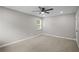 Comfortable main bedroom is complete with carpet floors and ceiling fan at 1819 Laurel Ridge Sw Dr, Conyers, GA 30094