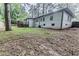 Lush backyard with a well-maintained lawn and a cozy wooden deck at 2174 Beecher Sw Rd, Atlanta, GA 30311