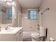 Bathroom features a shower-tub combination and a white vanity with a mirror at 2174 Beecher Sw Rd, Atlanta, GA 30311