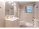 Bright bathroom with a tub, shower, vanity and a well-lit mirror at 2174 Beecher Sw Rd, Atlanta, GA 30311
