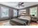 Inviting bedroom featuring hardwood floors, soft natural light, and a soothing neutral color palette at 2174 Beecher Sw Rd, Atlanta, GA 30311