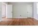 Spacious bedroom featuring natural lighting, hardwood floors and white doors at 2174 Beecher Sw Rd, Atlanta, GA 30311