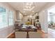 Bright dining area with wood floors and views to the kitchen and living areas at 2174 Beecher Sw Rd, Atlanta, GA 30311