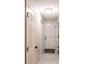 Welcoming hallway with sleek floors, multiple doors, and contemporary lighting at 2174 Beecher Sw Rd, Atlanta, GA 30311