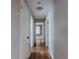 Hallway with hardwood flooring and doors leading to various rooms at 2174 Beecher Sw Rd, Atlanta, GA 30311