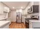 Modern kitchen features stainless steel appliances, sleek countertops, and ample cabinet space at 2174 Beecher Sw Rd, Atlanta, GA 30311