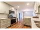 Modern kitchen featuring stainless appliances, beautiful countertop space, and hardwood floors at 2174 Beecher Sw Rd, Atlanta, GA 30311