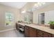 Bathroom featuring granite countertops, wooden cabinets and tile flooring at 803 Brookhavenrun Cir, Duluth, GA 30097