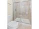 Bathroom features a glass-enclosed shower with tile surround and sliding doors at 803 Brookhavenrun Cir, Duluth, GA 30097