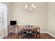Small breakfast nook with a modern chandelier, a round table and lots of natural light at 803 Brookhavenrun Cir, Duluth, GA 30097