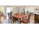 Bright dining area with hardwood floors, an ornate wooden table, and a view to other rooms at 803 Brookhavenrun Cir, Duluth, GA 30097