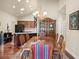 Spacious dining area with a chandelier, hardwood floors and adjacent kitchen view at 803 Brookhavenrun Cir, Duluth, GA 30097
