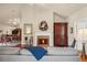 Inviting living room features a fireplace, hardwood floors, and cozy seating arrangement at 803 Brookhavenrun Cir, Duluth, GA 30097