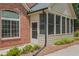 Attached sunroom offers natural light and views of the garden at 803 Brookhavenrun Cir, Duluth, GA 30097