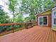Spacious back deck off the main living space featuring views of mature trees and landscaping at 1257 Independence Way, Marietta, GA 30062