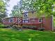 Expansive backyard view with a deck and stairs leading to the yard at 1257 Independence Way, Marietta, GA 30062