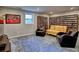 Finished basement with built-in shelving and comfortable seating area at 1257 Independence Way, Marietta, GA 30062