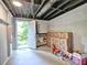 Unfinished basement with walkout access, offering ample storage and potential for customization at 1257 Independence Way, Marietta, GA 30062