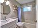 Bathroom featuring a combination tub and shower, toilet and sink at 1257 Independence Way, Marietta, GA 30062