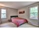 Cozy bedroom featuring two windows, neutral walls, and an understated decor at 1257 Independence Way, Marietta, GA 30062