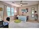 Bright bedroom with a bed, desk, and large window overlooking outdoor scenery at 1257 Independence Way, Marietta, GA 30062