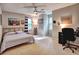 Spacious bedroom with a ceiling fan, a bed, and a desk area at 1257 Independence Way, Marietta, GA 30062