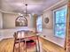 Traditional dining room with hardwood floors, chair rail, and natural light from two windows at 1257 Independence Way, Marietta, GA 30062