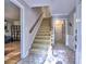 Inviting foyer features a staircase, a beautiful tile floor, and neutral paint at 1257 Independence Way, Marietta, GA 30062