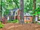 Charming brick home surrounded by mature trees and landscaping at 1257 Independence Way, Marietta, GA 30062