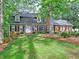Charming brick home with a well-maintained front yard and mature trees at 1257 Independence Way, Marietta, GA 30062