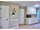 Kitchen area with white cabinets, wood countertops, and stainless steel microwave at 1257 Independence Way, Marietta, GA 30062