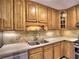 The kitchen showcases oak cabinets, stainless steel appliances, and tile backsplash at 1257 Independence Way, Marietta, GA 30062