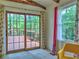 Bright living area featuring sliding glass doors to the deck with tree views at 1257 Independence Way, Marietta, GA 30062