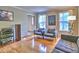 Cozy living room showcases hardwood floors, neutral decor, and ample natural light at 1257 Independence Way, Marietta, GA 30062