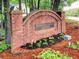 Brick community sign for Independence Square with manicured landscaping, showcasing a welcoming entrance at 1257 Independence Way, Marietta, GA 30062