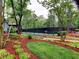 Beautifully landscaped tennis court area with surrounding greenery, providing an active and scenic recreational space at 1257 Independence Way, Marietta, GA 30062