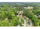Overhead image of a charming home nestled within a tree-filled neighborhood, near a lake and golf course at 1405 Arden Trace Ln, Lawrenceville, GA 30043