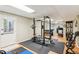 Finished basement fitness area with rubber mat floor, gym equipment, and neutral paint at 1405 Arden Trace Ln, Lawrenceville, GA 30043