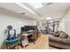 Finished basement with laminate wood flooring, fitness and office areas, and neutral decor at 1405 Arden Trace Ln, Lawrenceville, GA 30043