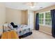 Comfortable bedroom with a ceiling fan, natural light, and space for a bed and furniture at 1405 Arden Trace Ln, Lawrenceville, GA 30043