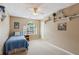 Cozy bedroom with neutral walls, carpet floors, ample shelving and a large window for natural light at 1405 Arden Trace Ln, Lawrenceville, GA 30043